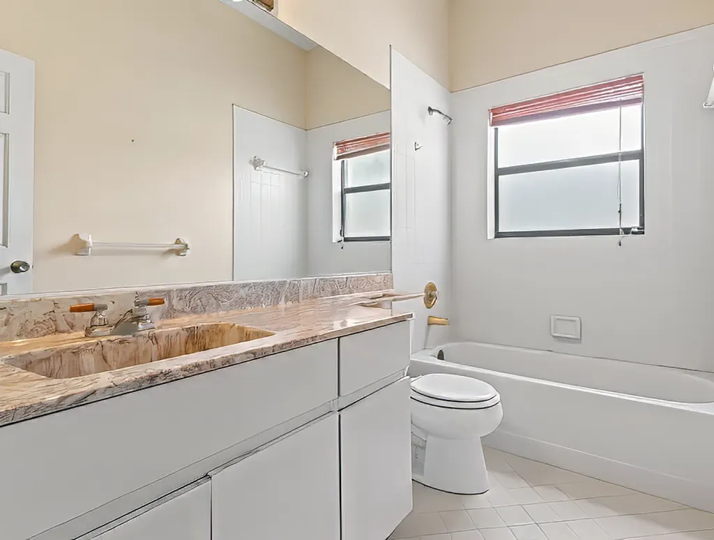 Before remodel: outdated 90s primary bath